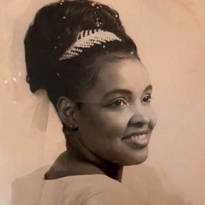 Smiling woman with elegant hairstyle, vintage photo