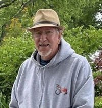 Man in hat with garden background