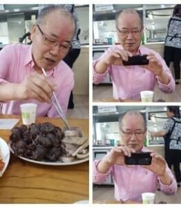 Man enjoys meal and photographs it.