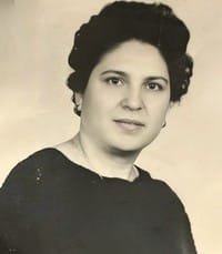 Vintage portrait of a woman in black sweater.