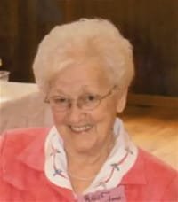 Smiling elderly woman in pink jacket