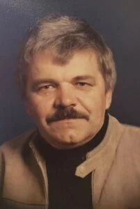 BLUMBERGS, John Harold Blumbergs