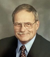 Smiling man in glasses and suit portrait