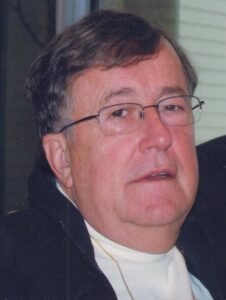 Elderly man with glasses and gray hair