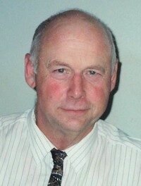 Man in white shirt with patterned tie