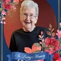 Elderly woman smiling with floral border, memorial banner.