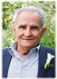 Elderly man in a suit with a boutonniere
