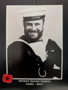 Smiling navy sailor in uniform, Korea war era.