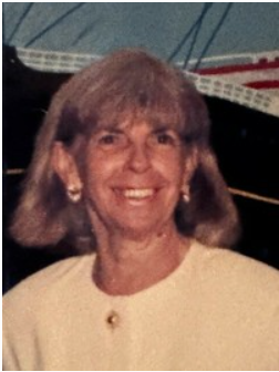 Smiling woman with light hair and earrings