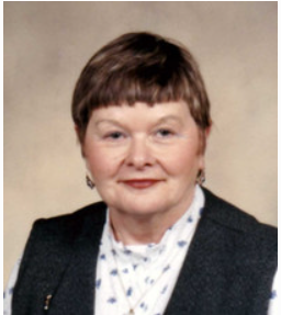 Portrait of a woman in professional attire.