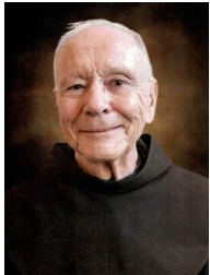 Elderly man with warm smile in dark robe.