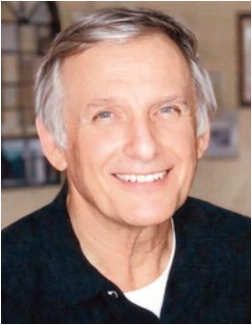 Smiling man in casual attire indoors