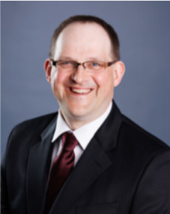 Smiling man in suit and glasses portrait