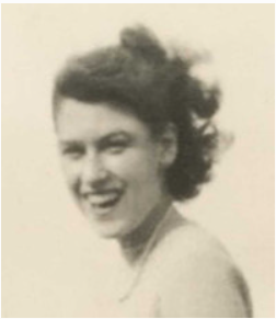 Smiling woman in vintage black and white photo.