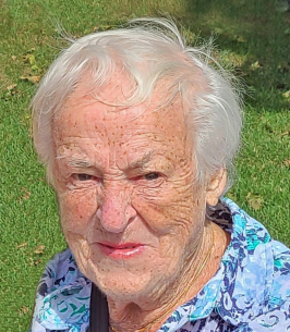 OUDSHOORN, Cornelia "Corrie" Oudshoorn Elderly woman outdoors in floral shirt