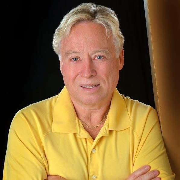 BONE, Wayne Christopher Bone Man in yellow shirt against dark background