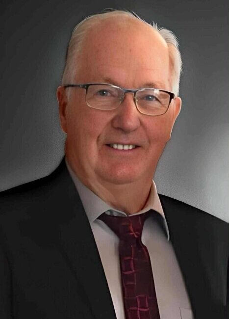 Man in suit and glasses smiling portrait