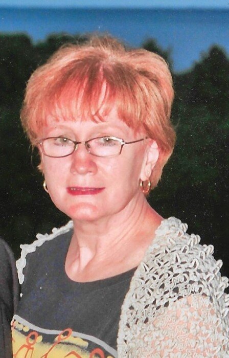 LOTT, Mary Lott Person with glasses outside, wearing a lace shirt.