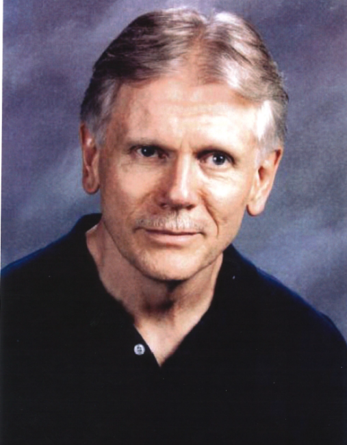 Portrait of an older man with gray hair.
