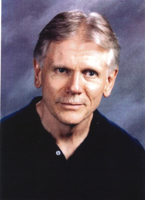 Portrait of an older man with gray hair.