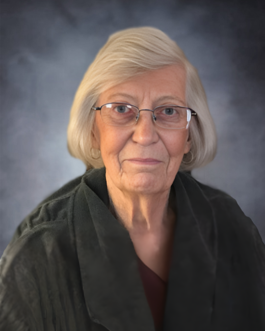 Elderly woman with glasses and gray hair portrait.