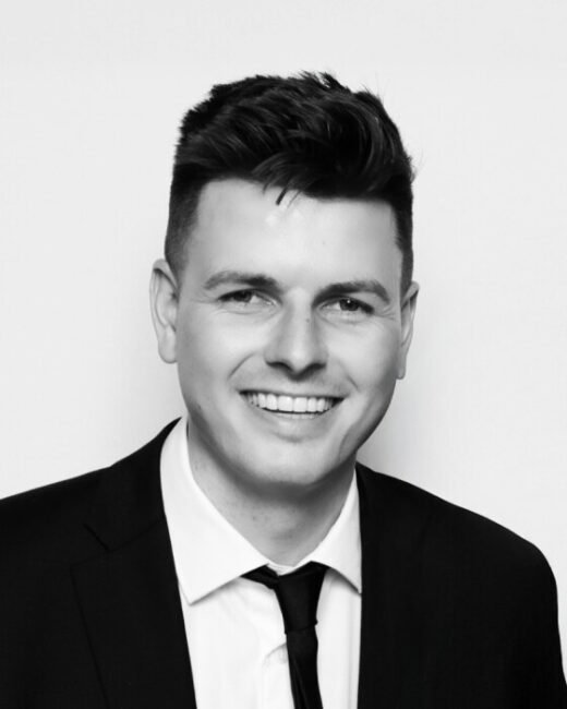 Smiling man in a suit portrait.