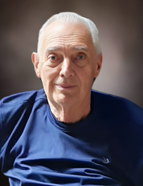 HEFFORD, Doug Hefford Elderly man in blue shirt smiling.