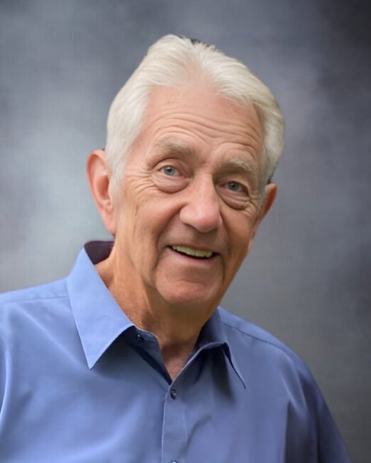 Smiling elderly man in blue shirt