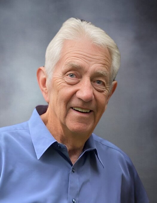 Smiling elderly man in blue shirt