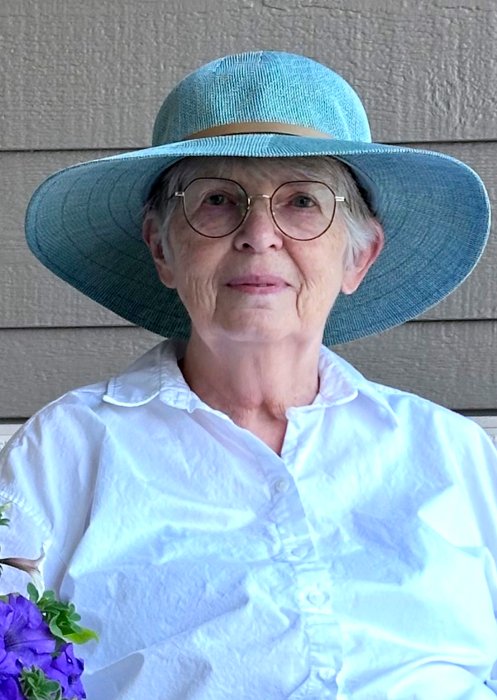 KENDRICK, Judith Anne Kendrick Woman wearing blue sunhat and glasses outdoors.