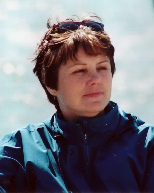 Woman in blue jacket on a boat
