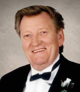 Smiling man in tuxedo with boutonniere