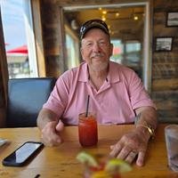 Man enjoying drink at a restaurant table