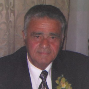Elderly man in suit with flower boutonniere
