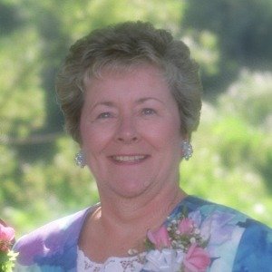 Smiling woman in floral outfit outdoors