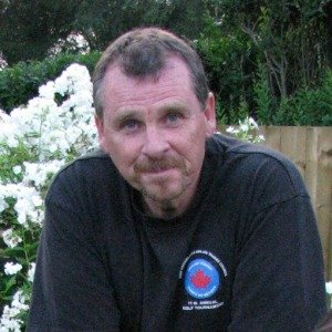 Man in garden with white flowers background