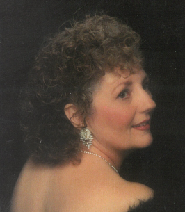 Elegant woman with curly hair and earrings