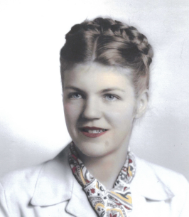 Smiling woman with braided hairstyle in vintage attire.