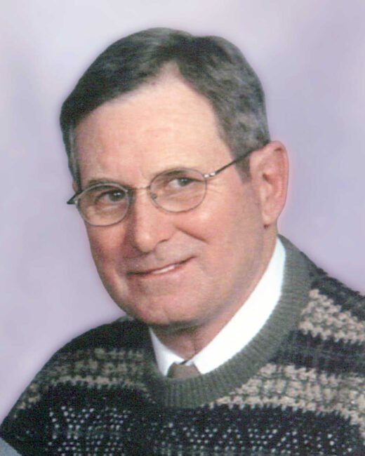 Man in glasses wearing a patterned sweater