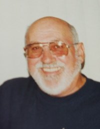 Smiling man with glasses and beard