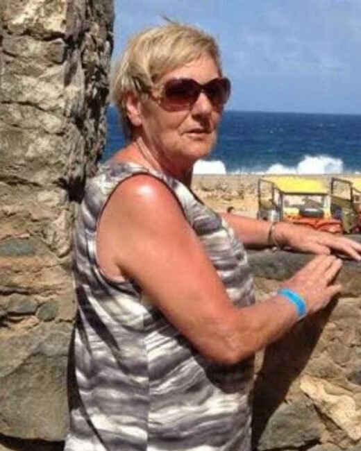 Woman enjoying coastal view, sunglasses, summer day