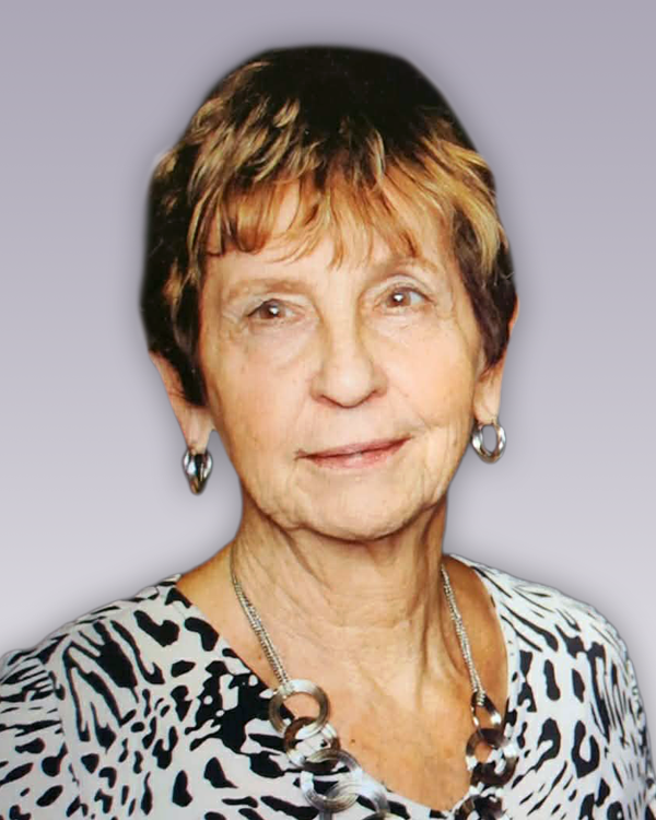 LAVIN, Agnes Lavin Elderly woman with short hair and earrings smiling.