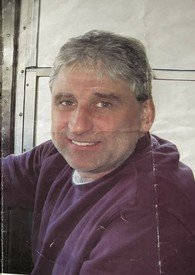 Man smiling inside vehicle