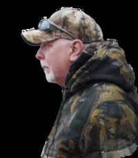 Man in camouflage jacket and cap, side profile