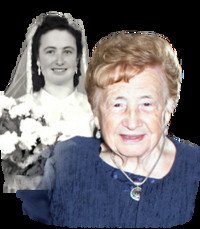 Elderly woman with bride photo in background.