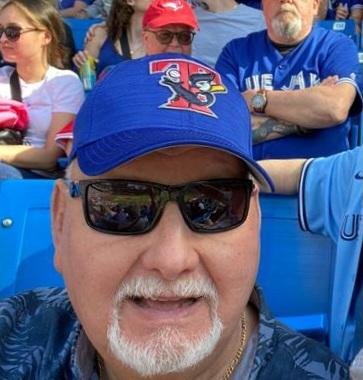 Man enjoying baseball game at stadium