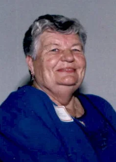 Smiling older woman with short hair in blue