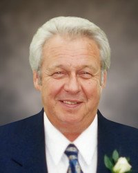 Smiling older man in a suit and tie