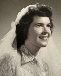 SCHAEFER, Betty Marie Schaefer Smiling woman in vintage wedding dress and veil.
