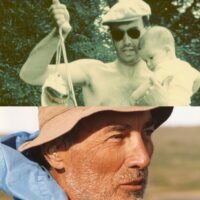 Man holding baby; older man outdoors.